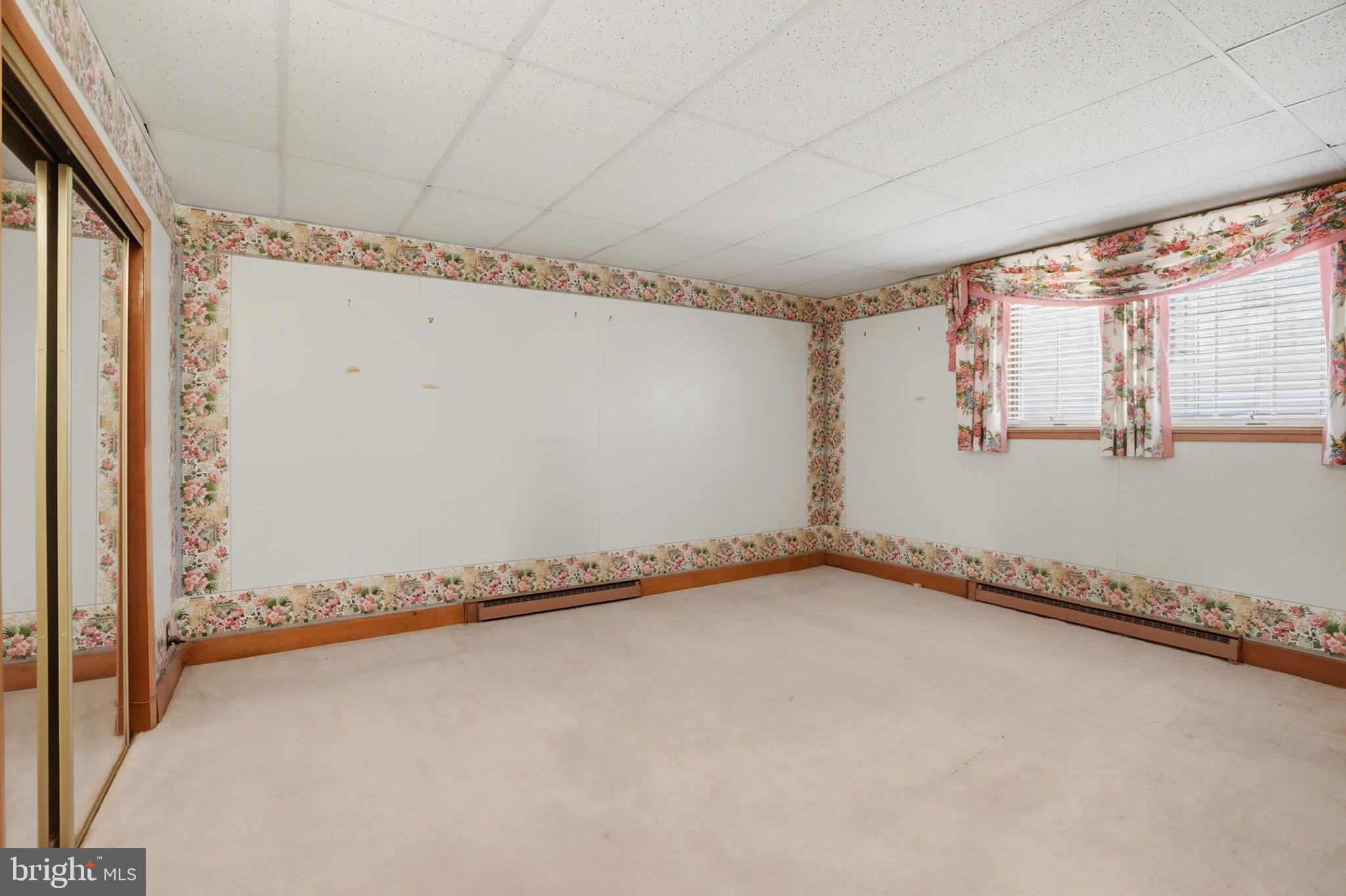 14917 Claude Lane Silver Spring, MD 20905 - Photo 35 of 52 a view of a room with rack and wooden floor