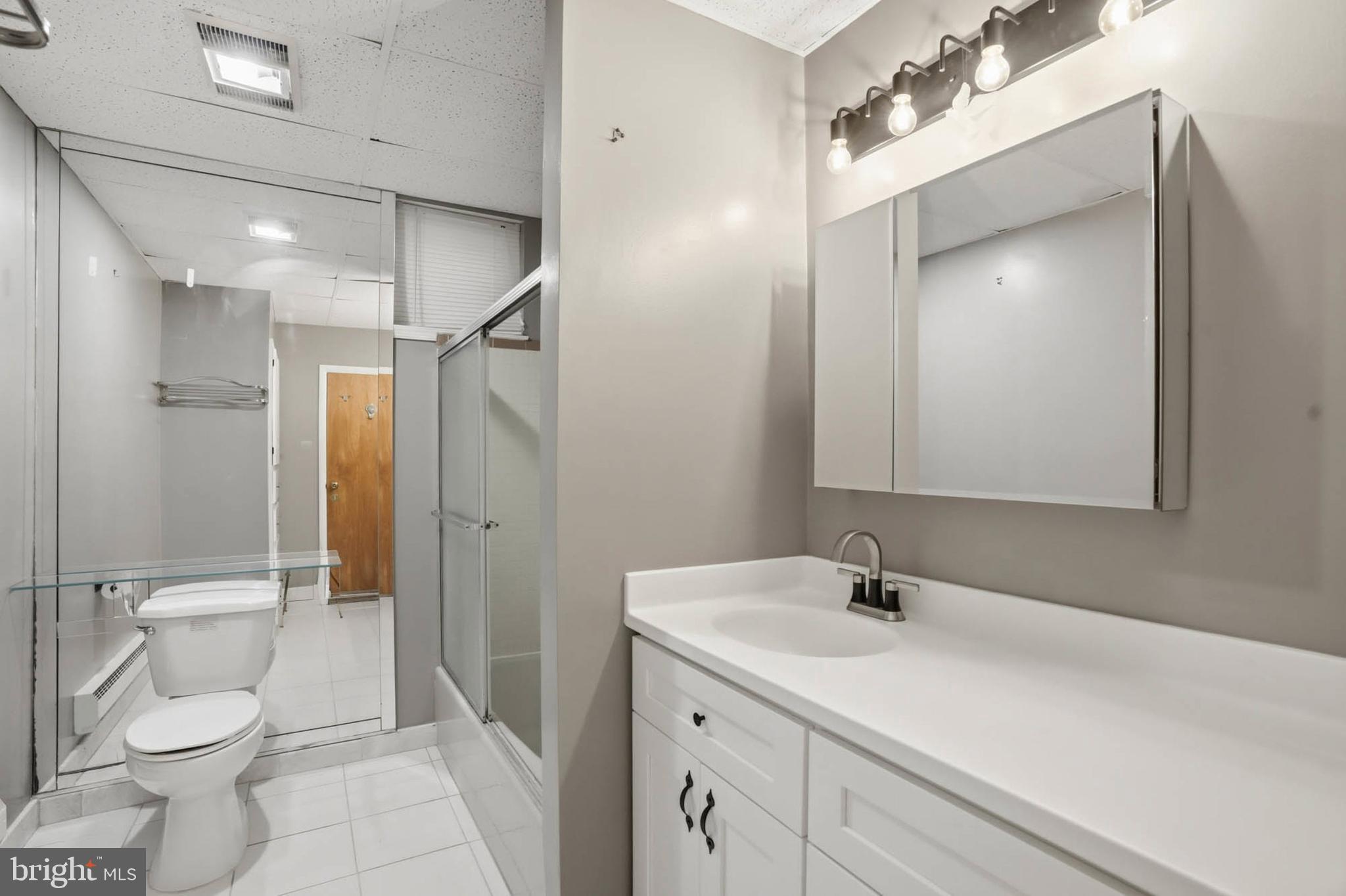 14917 Claude Lane Silver Spring, MD 20905 - Photo 38 of 52 a bathroom with a sink a toilet and shower