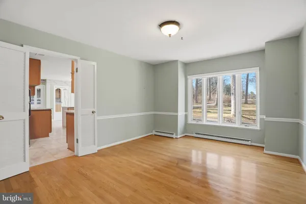 a view of a balcony with wooden floor and fence