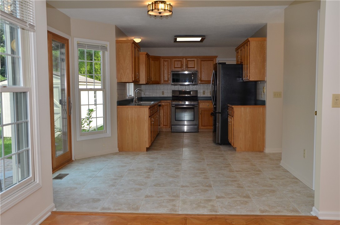 1092 Wickerton Lane Webster, NY 14580 - Photo 6 of 38 View from family room into kitchen.