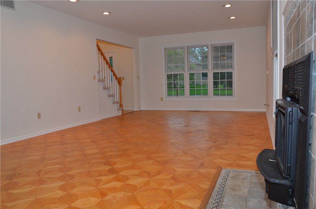 1092 Wickerton Lane Webster, NY 14580 - Photo 7 of 38 View of family room towards front windows.
