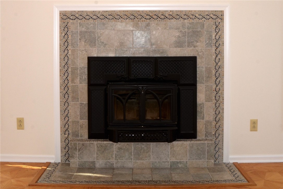 1092 Wickerton Lane Webster, NY 14580 - Photo 10 of 38 Beautiful tile surrounds the Jøtul C 450 Tamarack