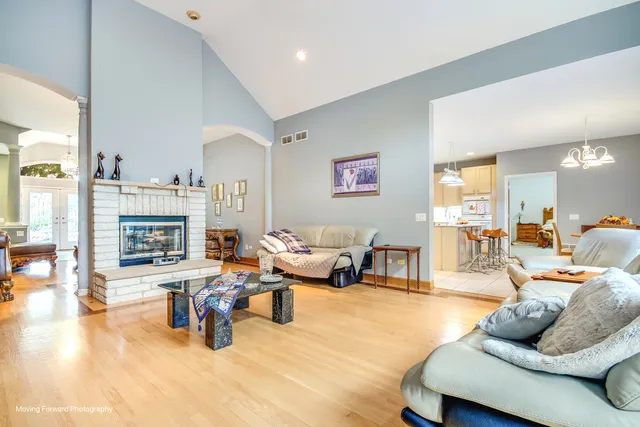 a living room with furniture and a fireplace