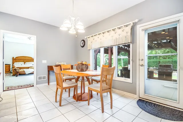a dining room with furniture and window