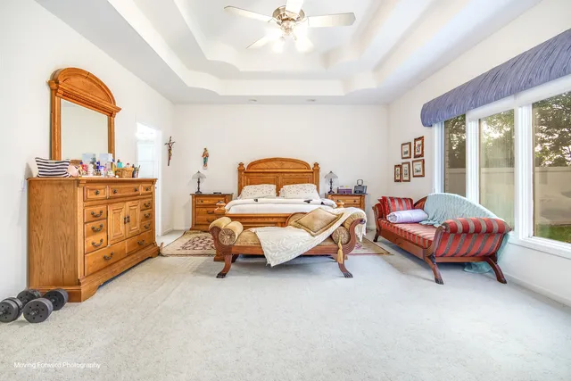 a bedroom with bed and window