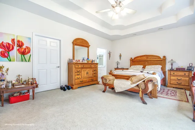 a bedroom with bed and window