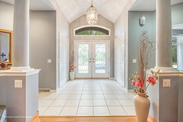 a view of an entryway with a chandelier