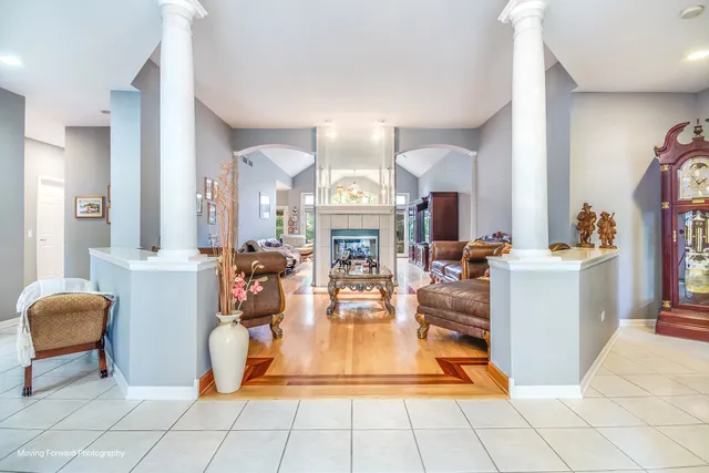 a view of living room kitchen with furniture and fireplace