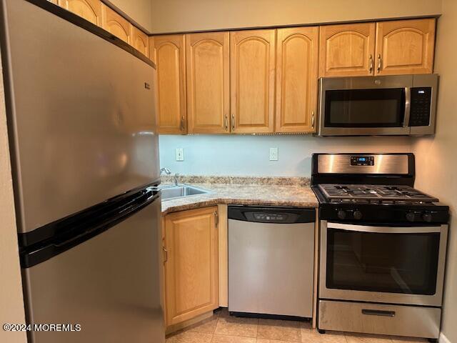 440 Cross Road, Unit C11 Matawan, NJ 07747 - Photo 1 of 6 a kitchen with stainless steel appliances granite countertop a stove and a microwave