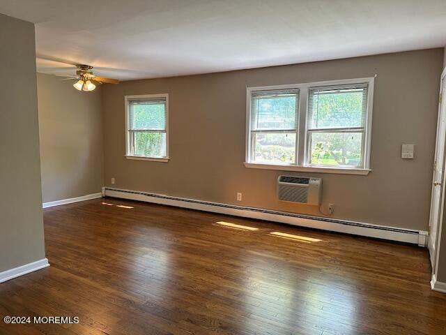 440 Cross Road, Unit C11 Matawan, NJ 07747 - Photo 3 of 6 a view of an empty room with wooden floor and a window