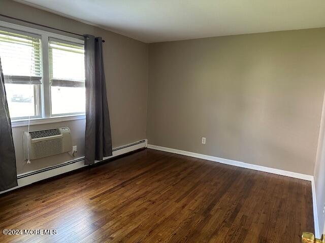 440 Cross Road, Unit C11 Matawan, NJ 07747 - Photo 4 of 6 an empty room with wooden floor and windows