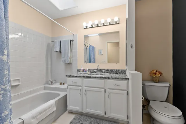 a bedroom with a bed closet and a window