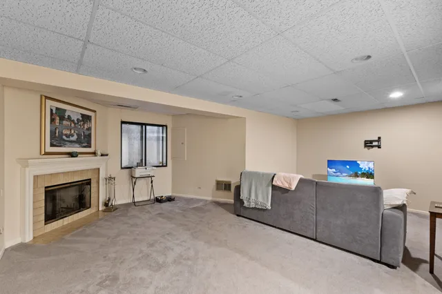 a bedroom with a bed and a dresser in it