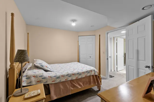 a bathroom with a double vanity sink mirror and toilet