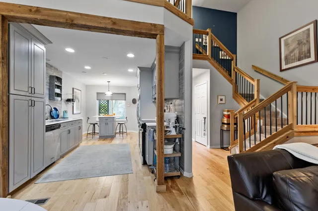 a hallway with dining table and chairs