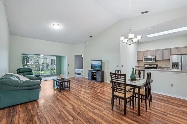 a living room with fireplace furniture and a wooden floor