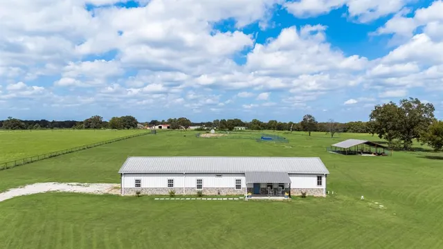 a view of a lake with houses in the back