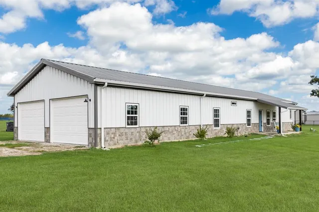 a front view of house with yard and seating area