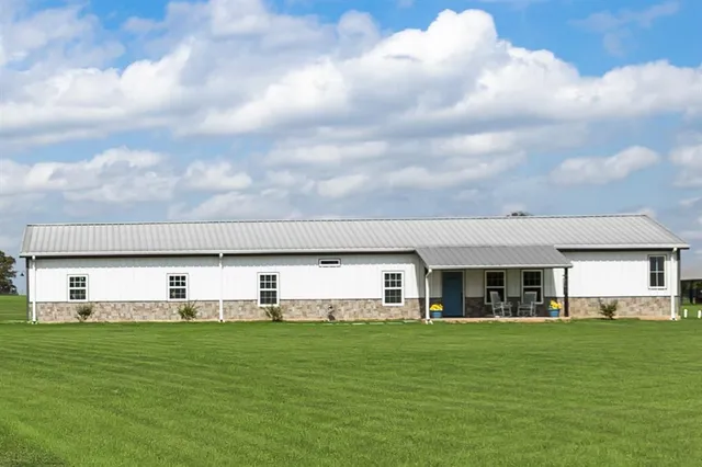 a view of a water with a large trees