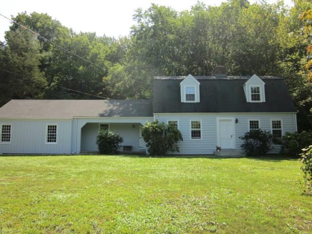 248 Redding Road Redding, CT 06896 - Photo 1 of 1 a front view of house with yard and trees in the background