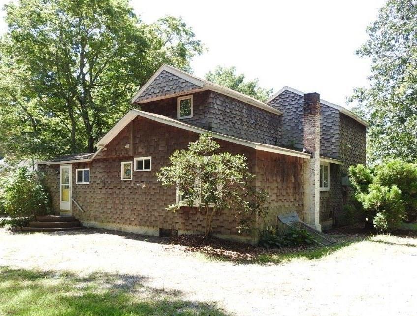 149 Liberty Street Clinton, CT 06413 - Photo 1 of 1 a front view of a house with a yard