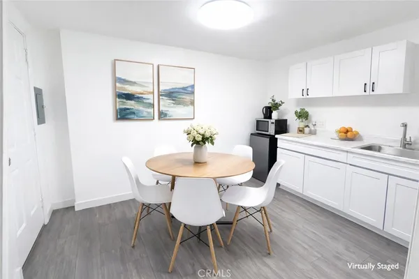 a dining room with furniture and window