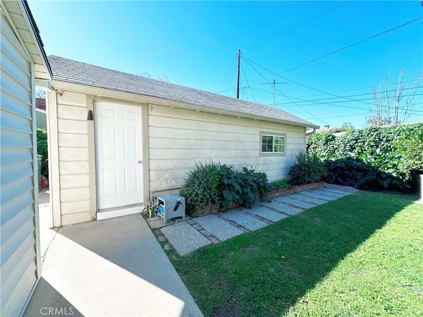 a view of backyard with potted plants