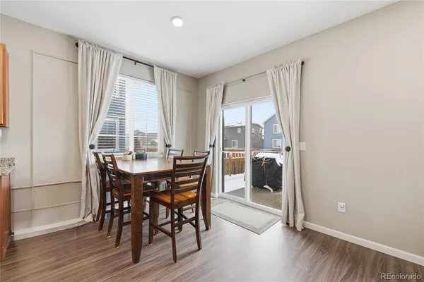 a view of a dining room with furniture and window