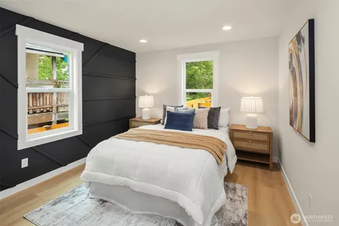 a bedroom with a large bed and a window