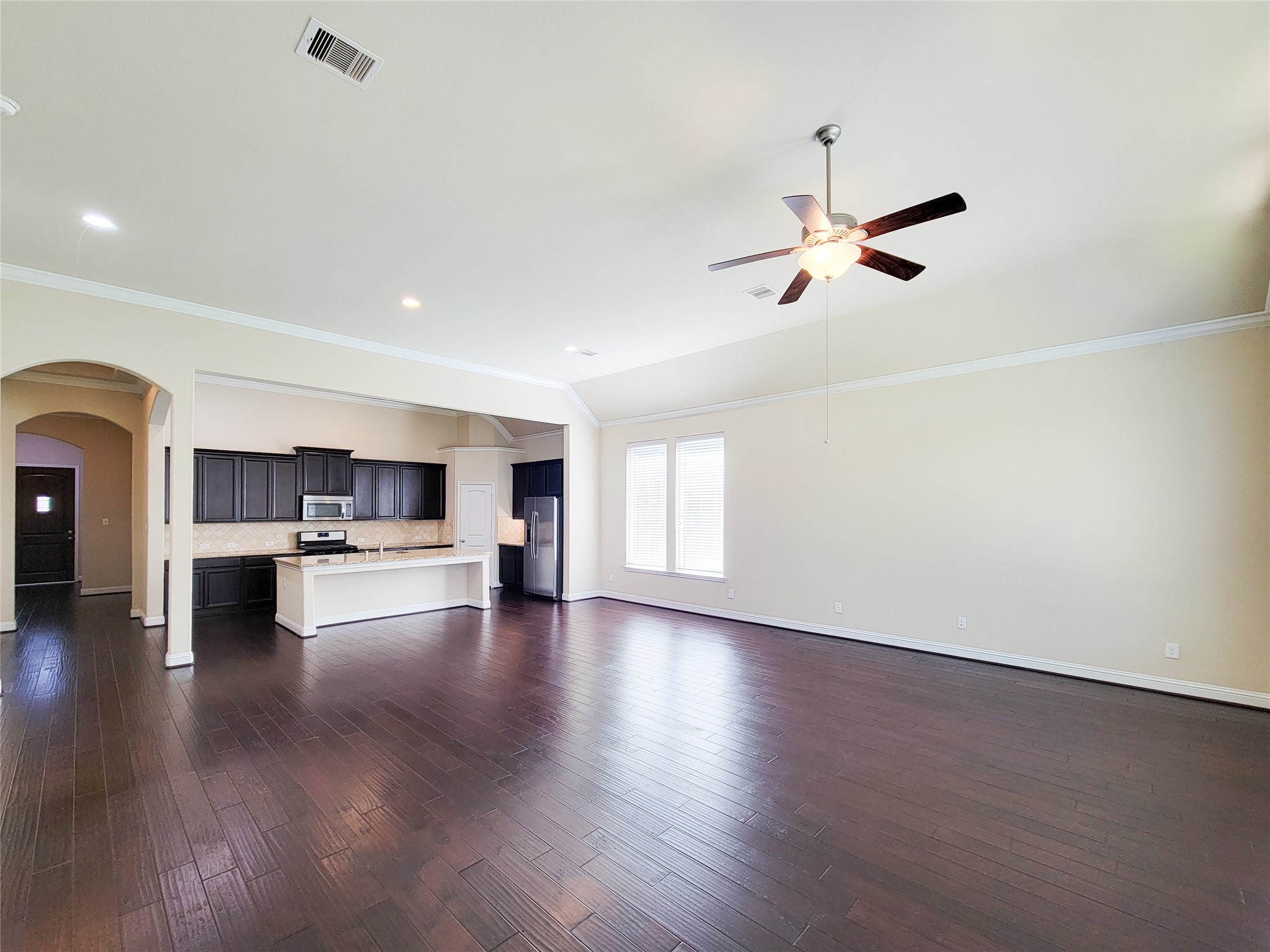 4102 Astoria Manor Lane Fulshear, TX 77441 - Photo 12 of 42 a view of kitchen and stove with wooden floor