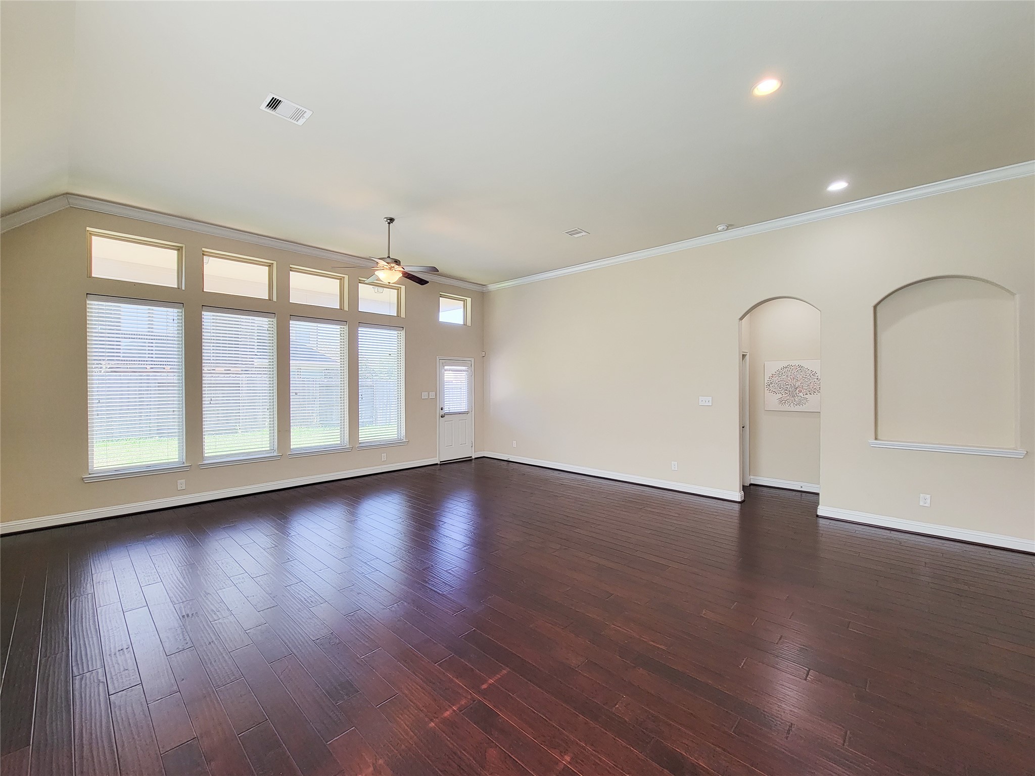 4102 Astoria Manor Lane Fulshear, TX 77441 - Photo 17 of 42 a view of an empty room with wooden floor and window