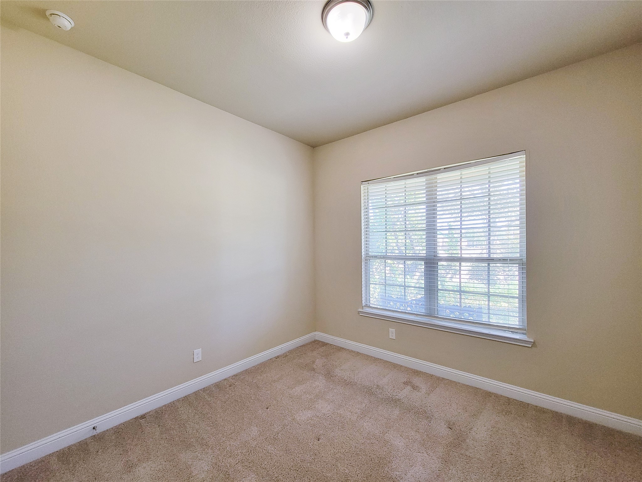 4102 Astoria Manor Lane Fulshear, TX 77441 - Photo 19 of 42 an empty room with a window