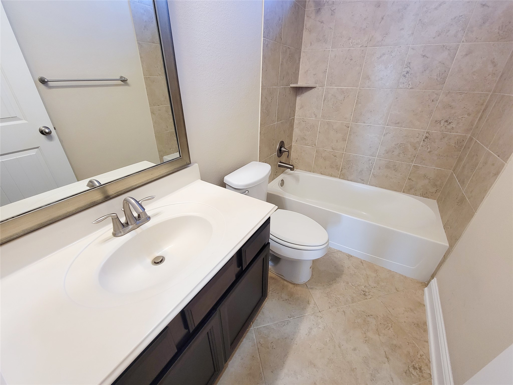 4102 Astoria Manor Lane Fulshear, TX 77441 - Photo 33 of 42 a bathroom with a sink and a bathtub
