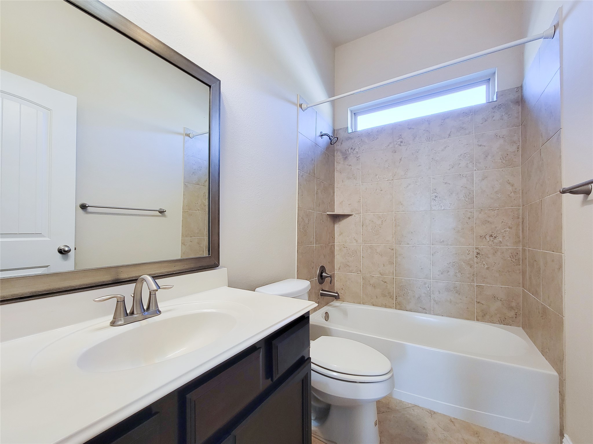 4102 Astoria Manor Lane Fulshear, TX 77441 - Photo 38 of 42 a bathroom with a sink a toilet a mirror and shower