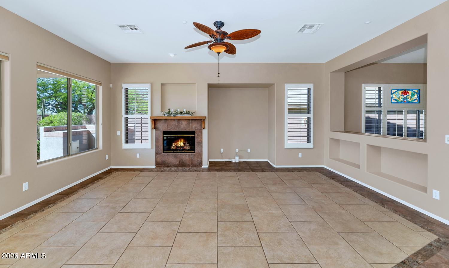 41123 North River Bend Road Phoenix, AZ 85086 - Photo 15 of 45 a view of an empty room with window and fire place