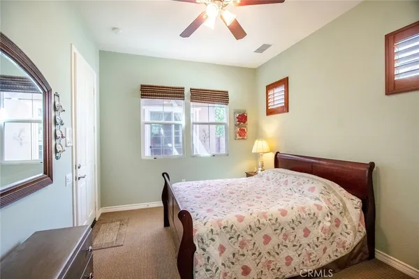 a white toilet sitting next to a bathroom sink
