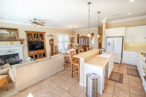 a spacious bathroom with a sink a bathtub and next to a window