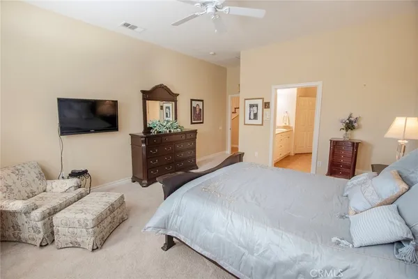 a large bathroom with a tub a sink and mirror