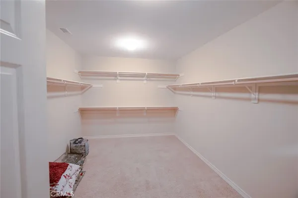 a spacious bathroom with a tub sink and mirror