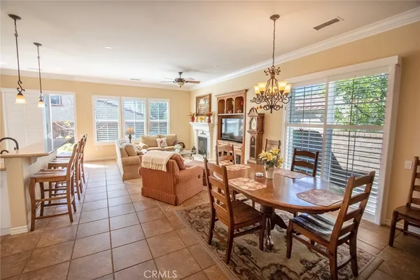 a dining room filled with furniture and window