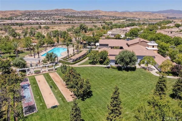 a view of a swimming pool with outdoor seating and yard