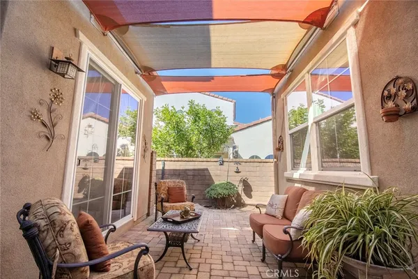 a outdoor space with patio furniture and potted plants