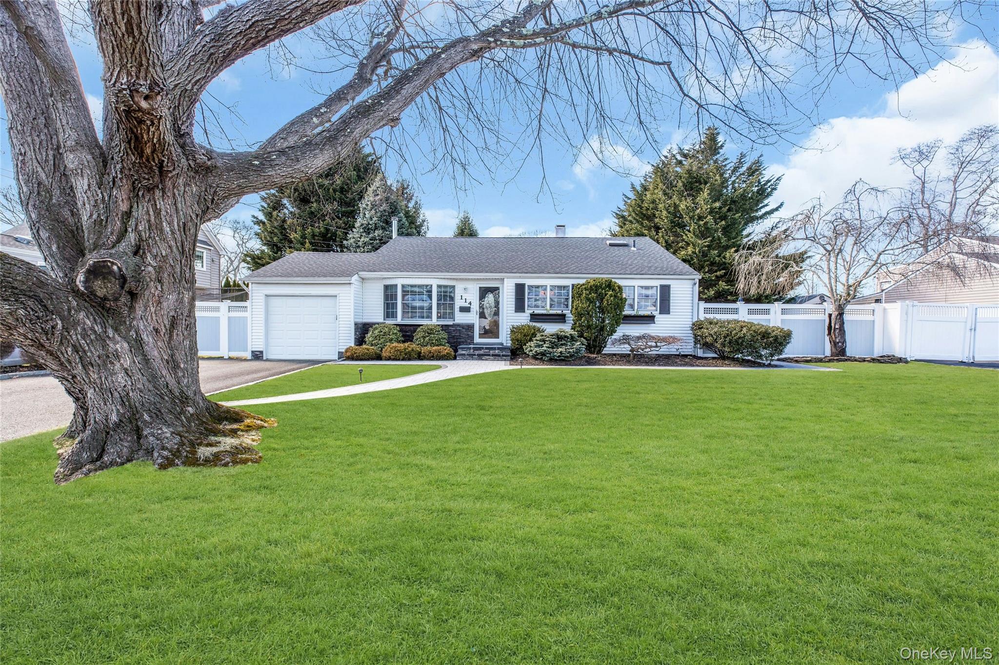 a house view with swimming pool and trees