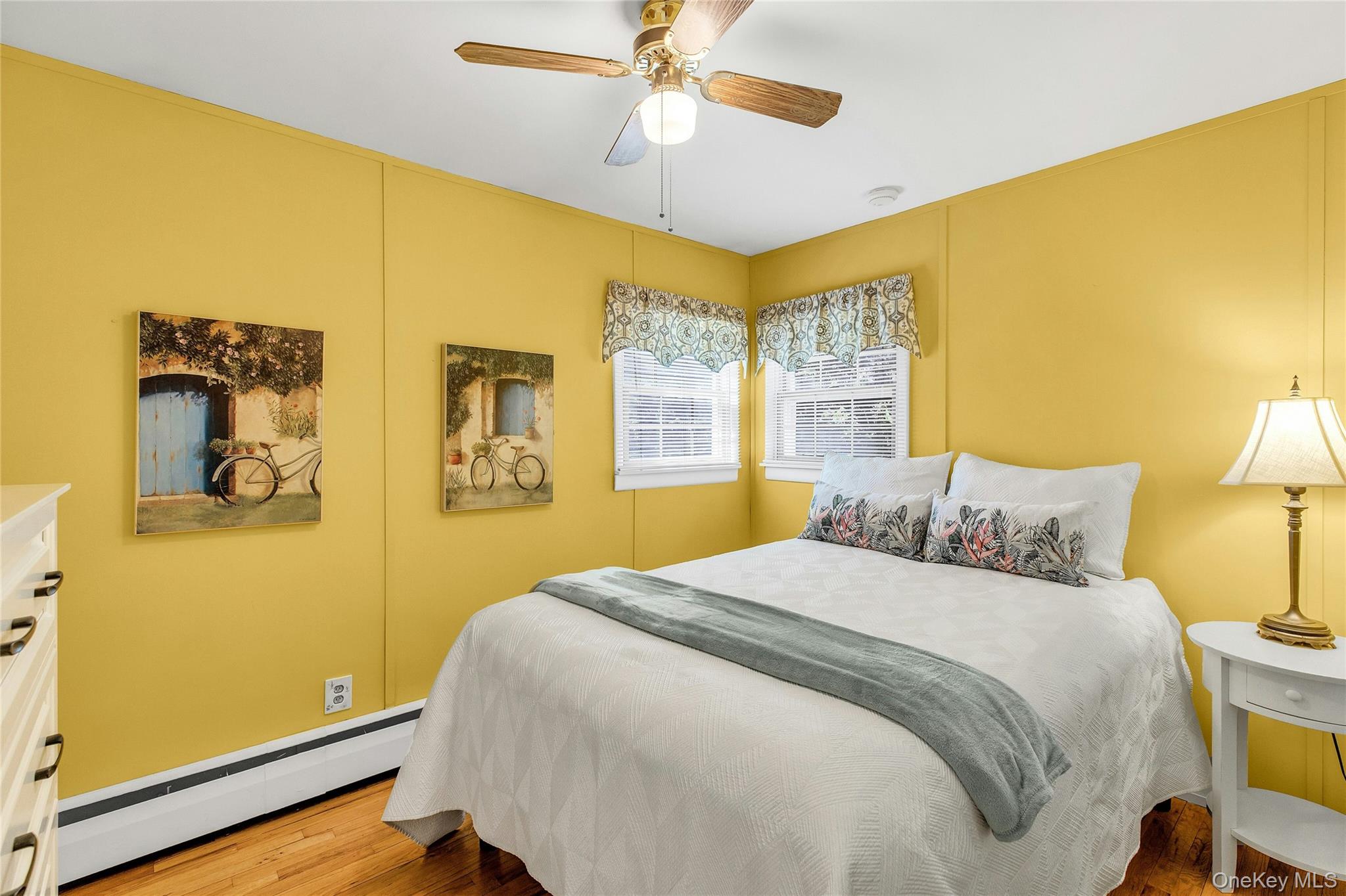 114 Lowell Road Sayville, NY 11782 - Photo 11 of 20 a bedroom with a bed and a lamp