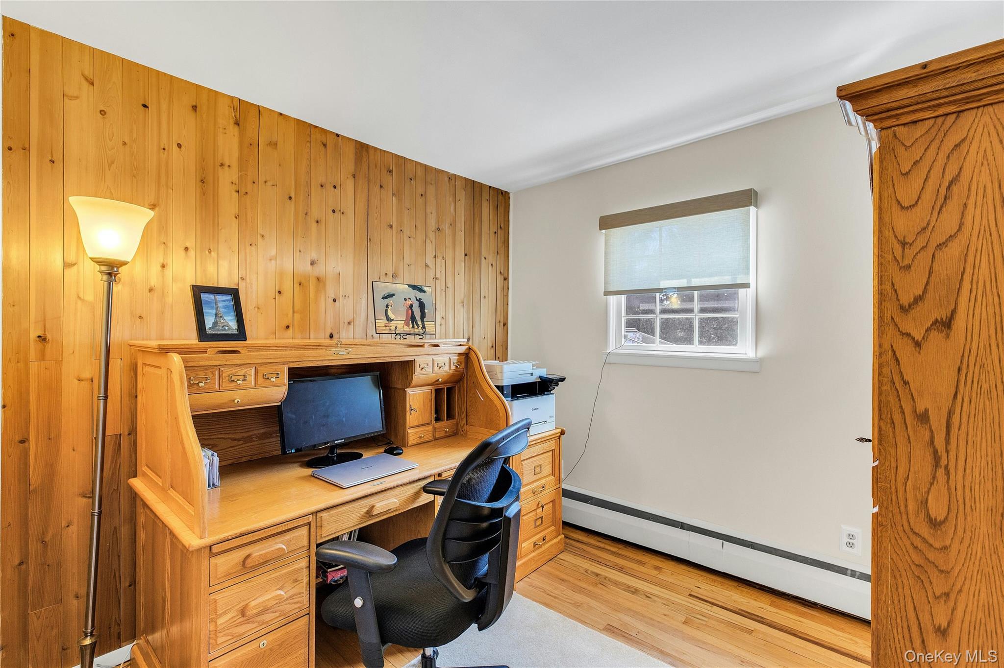 114 Lowell Road Sayville, NY 11782 - Photo 12 of 20 a room with a chair and a table