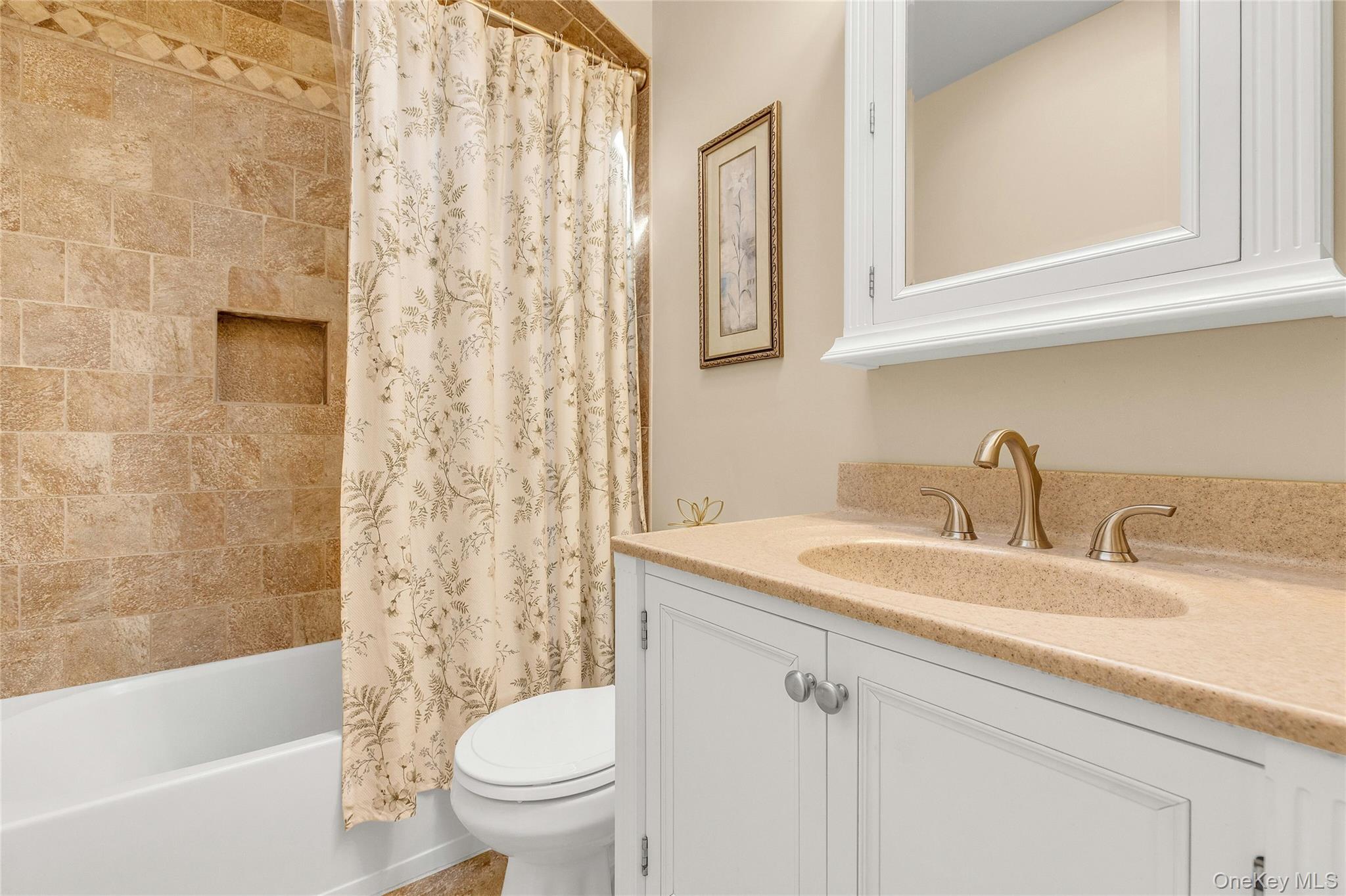 114 Lowell Road Sayville, NY 11782 - Photo 13 of 20 a bathroom with a sink toilet and shower