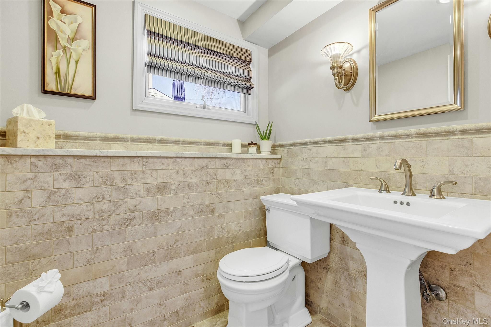 114 Lowell Road Sayville, NY 11782 - Photo 16 of 20 a bathroom with a toilet sink and mirror