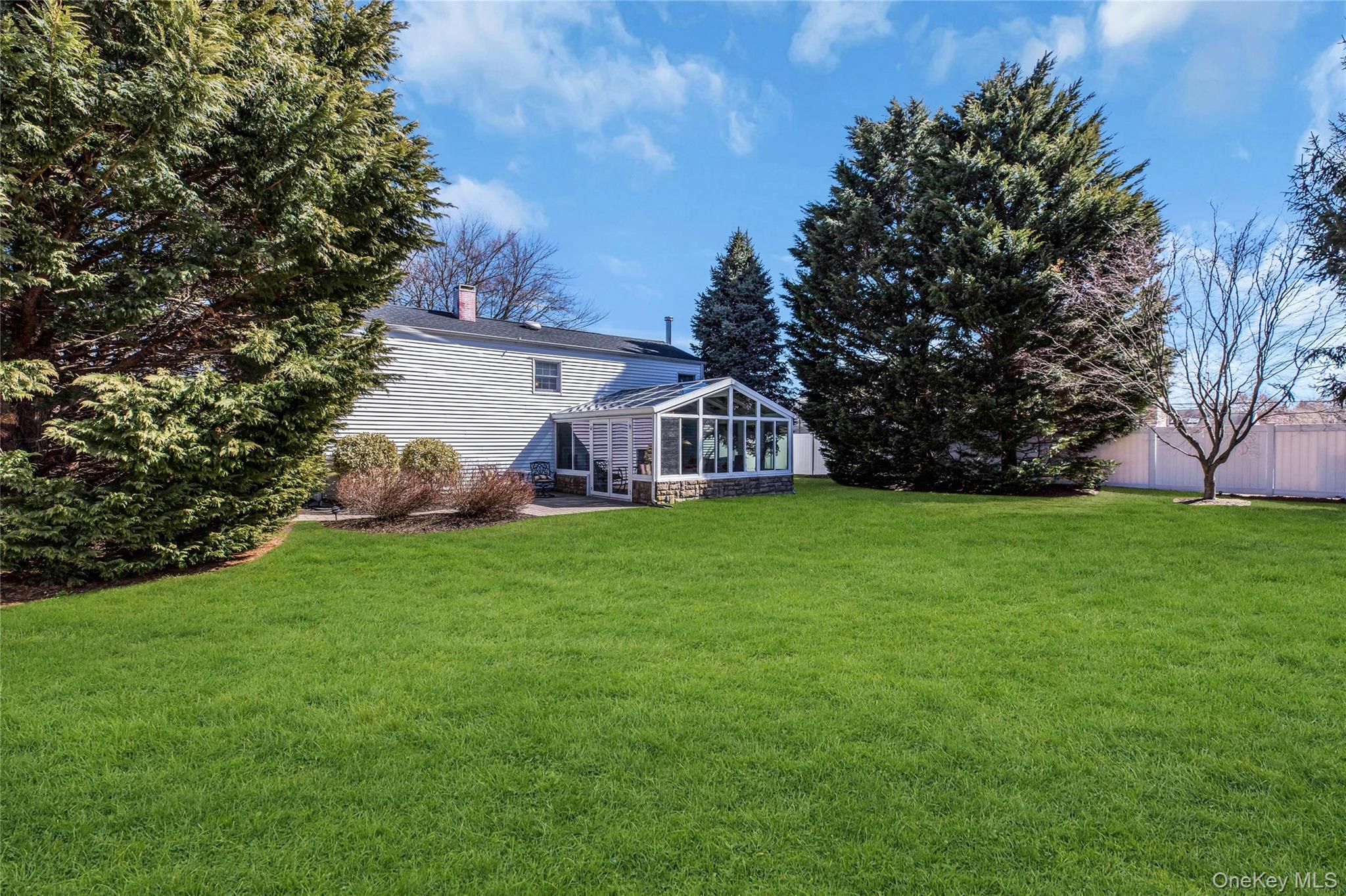 114 Lowell Road Sayville, NY 11782 - Photo 20 of 20 a view of a house with backyard and garden