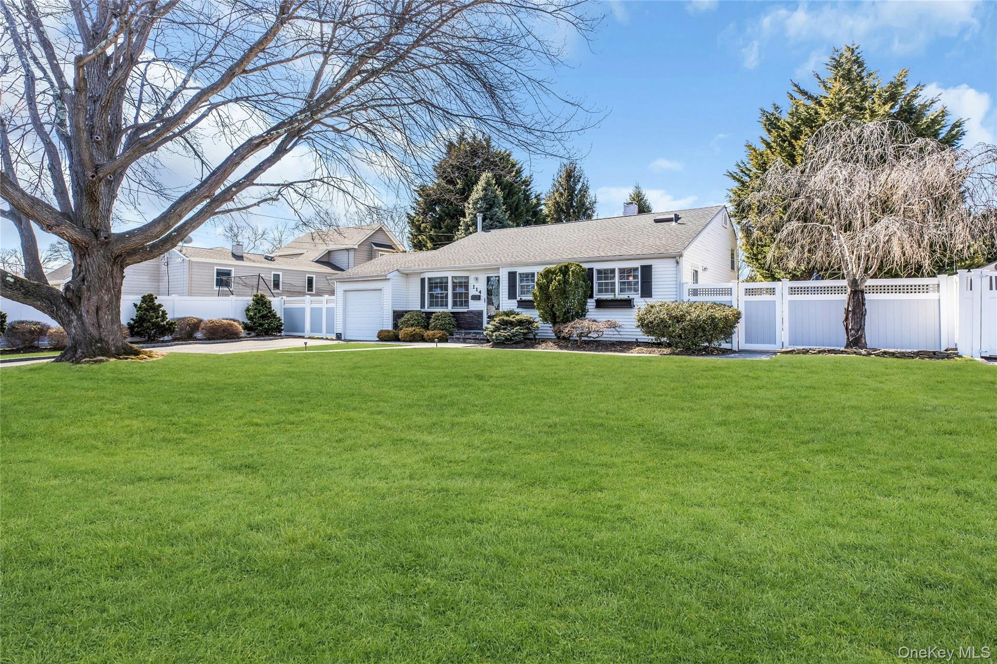114 Lowell Road Sayville, NY 11782 - Photo 2 of 20 a front view of house with yard and green space