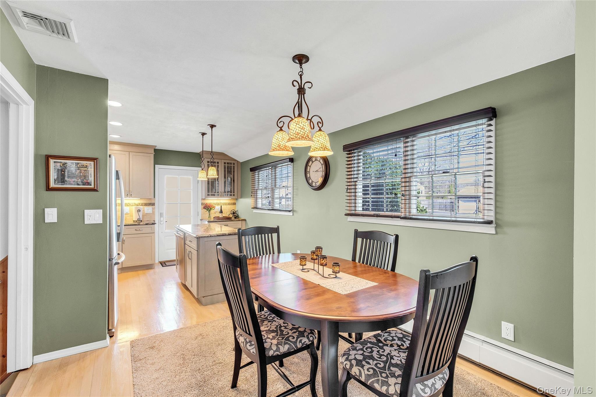 114 Lowell Road Sayville, NY 11782 - Photo 6 of 20 a view of a dining room with furniture window and wooden floor